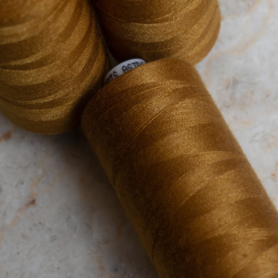 Ochre overlock bobbin x 4